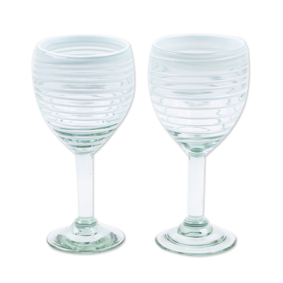 Handblown wine glasses, 'Luxury Spiral' (pair) - Pair of White Handblown Wine Glasses with Spiral Motifs