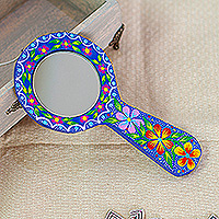 Wood hand mirror, 'Indigo Petals' - Handcrafted Indigo Copal Wood Hand Mirror with Floral Motifs