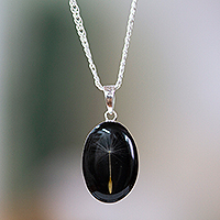 Natural flower pendant necklace, 'Nocturnal Rebirth' - Oval Black Natural Dandelion Resin Pendant Necklace