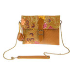 Leather sling, 'Casual Petunia' - Embossed Floral Copper-Toned Leather Sling from Mexico