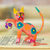 Alebrije-Figur aus Holz - Handbemalte Alebrije-Figur aus Holz mit einer Katze, die mit einem Ball spielt