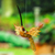Wood alebrije ornament, 'Caramel Flight' - Painted Caramel Copal Wood Alebrije Hummingbird Ornament (image 2) thumbail