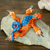 Wood alebrije figurine, 'Iguana Steps in Orange' - Hand-Painted Orange Copal Wood Alebrije Iguana Figurine