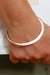 Copper bangle bracelet, 'Delightful Charm' - Modern Polished Copper Bangle Bracelet Crafted in Mexico