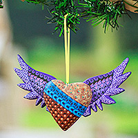 Wood alebrije ornament, 'Purple Wings of the Heart' - Hand-Painted Copal Wood Winged Heart Ornament in Purple
