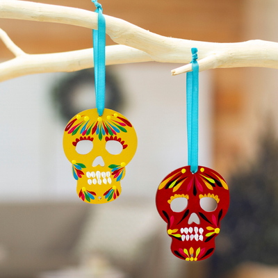 Wood ornaments, 'Mexican Tradition' (pair) - Pair of Hand-Painted Wood Day of the Dead Skull Ornaments