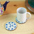 Wood coasters, 'Talavera Cheers' (pair) - Two Wood Coasters Hand-Painted in Talavera Style from Mexico