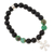 Onyx and reconstituted turquoise beaded stretch charm bracelet, 'Flower Glam' - Onyx Reconstituted Turquoise Floral Stretch Charm Bracelet