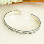 Sterling silver cuff bracelet, 'Aztec Charm' - Taxco Silver Cuff Bracelet with Aztec-Inspired Motifs