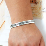 Sterling silver cuff bracelet, 'Aztec Charm' - Taxco Silver Cuff Bracelet with Aztec-Inspired Motifs