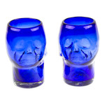 Handblown recycled glass tumblers, 'Blue Mexican Skull' (pair) - Two Blue Skull-Themed Handblown Recycled Glass Tumblers
