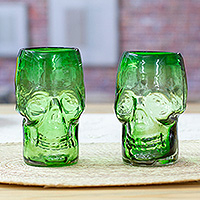 Handblown recycled glass tumblers, 'Jade Mexican Skull' (pair) - 2 Skull-Shaped Jade Green Handblown Recycled Glass Tumblers