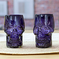 Handblown recycled glass tumblers, 'Purple Mexican Skull' (pair) - 2 Purple Handblown Recycled Glass Tumblers with Skull Motif