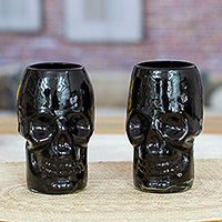 Handblown recycled glass tumblers, 'Black Mexican Skull' (pair) - Pair of Handblown Recycled Glass Skull Tumblers in Black Hue