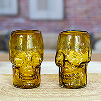 Handblown recycled glass tumblers, 'Amber Mexican Skull' (pair) - Pair of Handblown Recycled Glass Brown Skull-Themed Tumblers