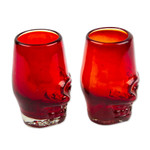 Handblown recycled glass tequila glasses, 'Red Mexican Skull' (pair) - 2 Red Skull-Themed Handblown Recycled Glass Tequila Glasses
