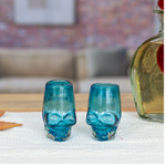 Handblown recycled glass tequila glasses, 'Aqua Mexican Skull' (pair) - 2 Aqua-Hued Handblown Recycled Glass Skull Tequila Glasses