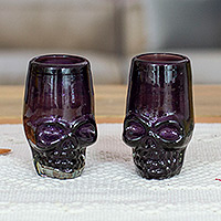 Handblown recycled glass tequila glasses, 'Purple Mexican Skull' (pair) - 2 Handblown Recycled Glass Tequila Glasses with Skull Motif