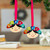 Wood ornaments, 'Merry Girls' (pair) - Whimsical Multicolor Painted Wood Ornament Pair from Mexico
