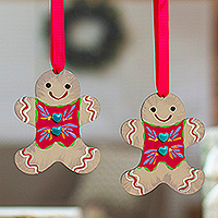 Wood ornaments, 'Ginger Love' (pair) - Pair of Gingerbread Man-Shaped Hand-Painted Wood Ornaments