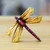 Wood magnet, 'Tiny Fluttering' - Golden and Pink Pinewood Dragonfly Magnet Carved in Mexico