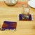 Wool coasters, 'Saffron Peaks' (set of 4) - Traditional 4-Piece Aubergine and Saffron Wool Coaster Set