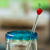 Handblown recycled glass drink stirrers, 'Red Apple Cheers' (pair) - 2 Handblown Recycled Glass Drink Stirrers with Apple Design