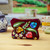 Embroidered cotton cosmetic bag, 'Spring Makeup' - Spring-Themed Embroidered Burgundy 100% Cotton Cosmetic Bag