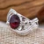 Garnet cocktail ring, 'Crimson Chic' - Garnet Sterling Silver Cocktail Ring with Leaf Accents