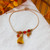 Carnelian and silk tassel bracelet, 'Tassel of Courage' - Honey-Toned Silk and Carnelian Tassel Bracelet from Mexico