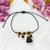 Onyx and silk tassel bracelet, 'Tassel of Puissance' - Black Silk and Onyx Tassel Bracelet Handcrafted in Mexico
