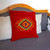 Zapotec wool cushion cover, 'Vibrant Eye of God' - Zapotec Red Wool Cushion Cover Woven by Hand in Mexico