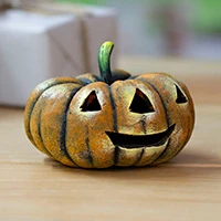 Ceramic figurine, 'Pumpkin Smile' - Halloween-Inspired Hand-Painted Ceramic Pumpkin Figurine
