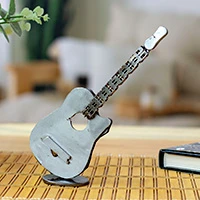 Recycled metal figurine, 'Glorious Guitar' - Guitar-Themed Figurine Handcrafted from Recycled Auto Parts