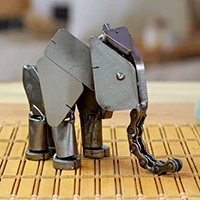 Upcycled metal sculpture, 'Micro Giant' - Elephant-Themed Eco-Friendly Upcycled Metallic Sculpture
