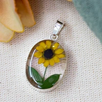 Natural flower resin pendant, 'My Adoration' - Spring-Inspired Natural Sunflower and Resin Oval Pendant