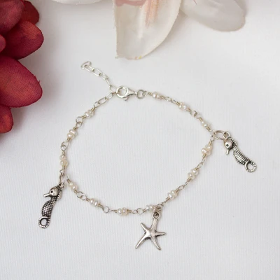 Cultured pearl charm bracelet, 'Oceanic Symphony' - Sea-Inspired Cultured Pearl Taxco Silver Charm Bracelet