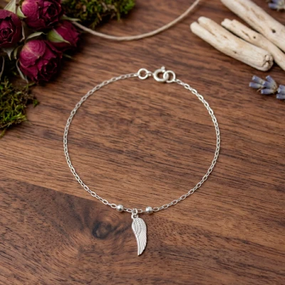 Sterling silver pendant bracelet, 'Wonderful Wing' - Angel Wing-Themed Taxco Silver Pendant Bracelet from Mexico
