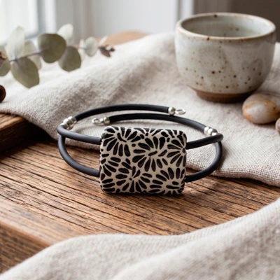 Ceramic pendant bracelet, 'Double Enigma' - Double-Strand Ceramic Pendant Bracelet in Black and White