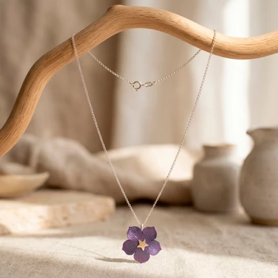 Titanium and sterling silver pendant necklace, 'Starry Hibiscus' - Hibiscus Flower Star-Themed Titanium Silver Pendant Necklace
