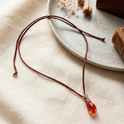 Crystal pendant necklace, 'Inner Blaze' - Red Swarovski Crystal Necklace with Adjustable Suede Cord