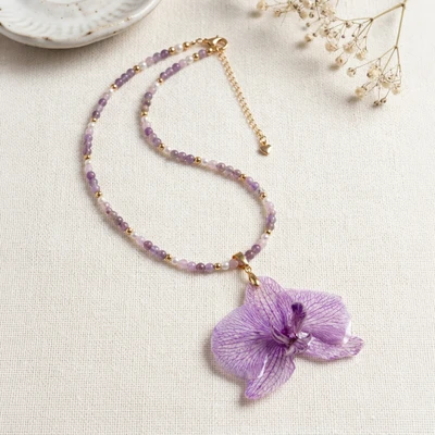Gold-accented natural flower, amethyst and rose quartz beaded statement necklace, 'Regal Orchid' - Gold-Accented Preserved Orchid Amethyst Rose Quartz Necklace