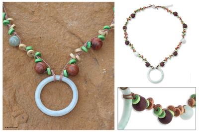 Jade and wood pendant necklace, 'Nature's Embrace' - Mango Wood and Jade Pendant Necklace