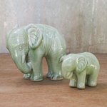 Celadon ceramic statuettes, 'Natural Nurture' (pair) - Green Celadon Ceramic Elephant Statuettes (Pair)
