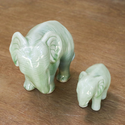 Celadon ceramic statuettes, 'Natural Nurture' (pair) - Green Celadon Ceramic Elephant Statuettes (Pair)