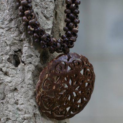 Coconut shell pendant necklace, 'Floral Medallion' - Thai Floral Coconut Shell Beaded Necklace