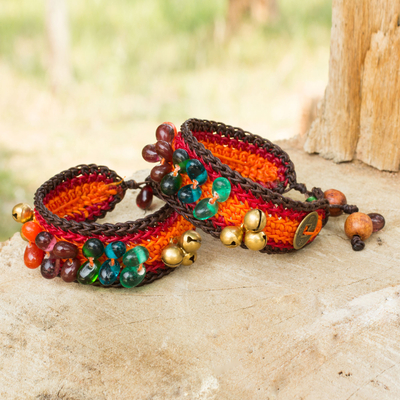 Beaded wristband bracelets, 'Bold Orange Fortunes' (pair) - Handcrafted Beaded Wristband Bracelets (Pair)