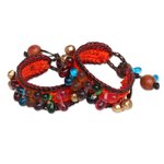 Beaded wristband bracelets, 'Bold Orange Fortunes' (pair) - Handcrafted Beaded Wristband Bracelets (Pair)