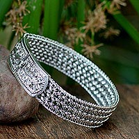 Sterling silver wristband bracelet, 'Woven Hideaway' - Handcrafted Floral Sterling Silver Wristband Bracelet
