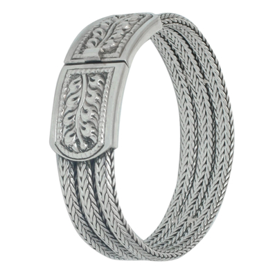Sterling silver wristband bracelet, 'Braided Hideaway' - Handcrafted Floral Sterling Silver Bracelet